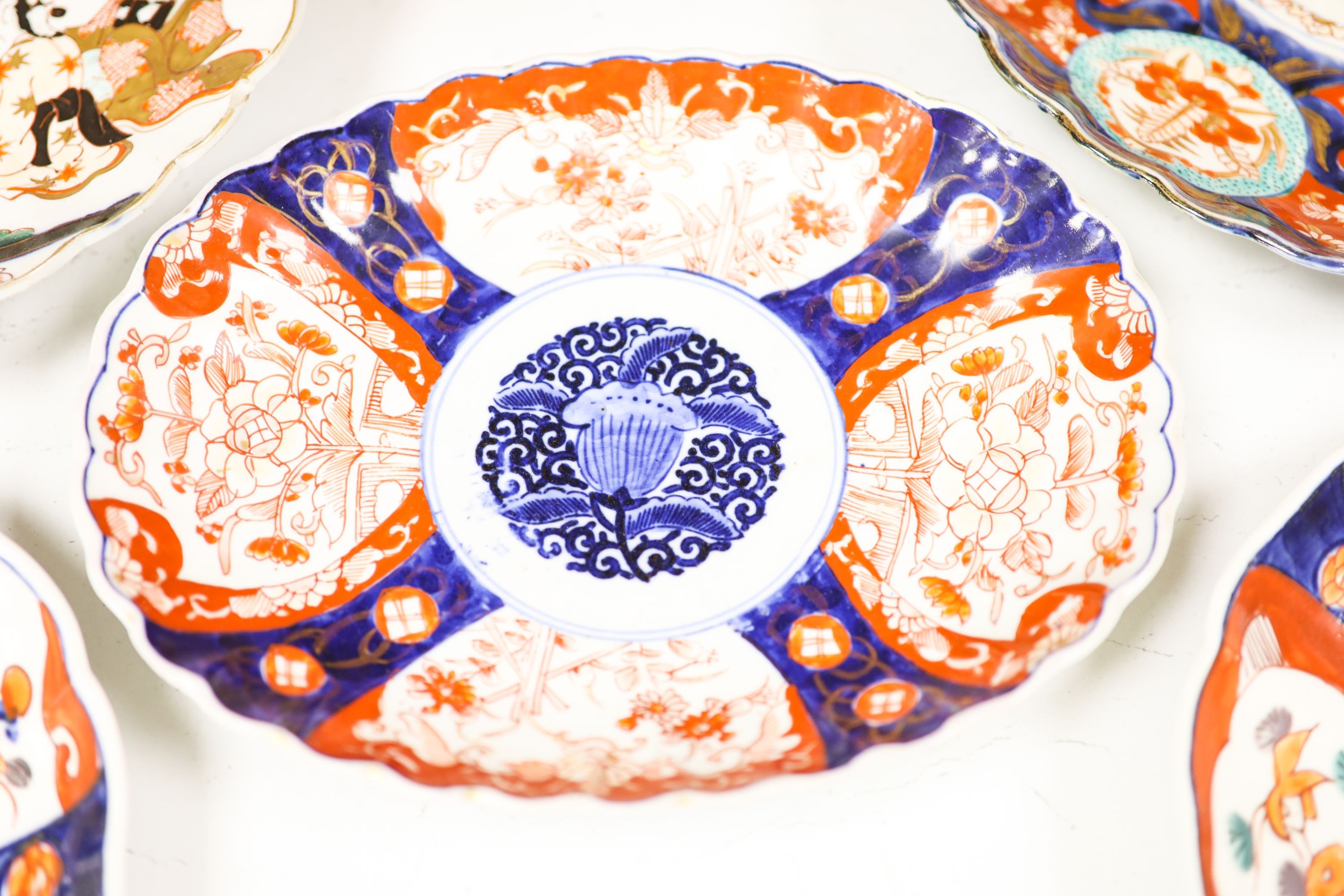 Five Japanese Imari dishes, largest 30.5 cm